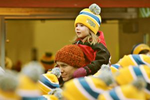 Little girls on her dad's shoulders at CNOY walk