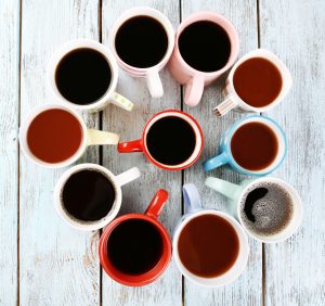 overhead shot of a group of mugs filled with coffee
