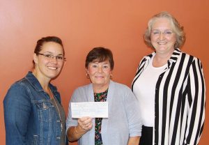 ROHCC Director Jessica VanEs (left) accepts a $7,500 cheque from Ann Moore and Linda Heber of the Nurses Entrepreneurial Foot Care Association.