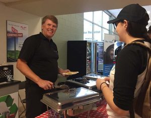 Scott Brush serves pancakes to guests at Heffner Toyota's 6th annual charity breakfast