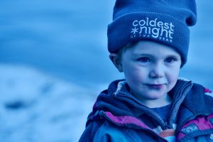 Small boy wearing a Coldest Night toque