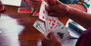 Closeup of hands holding playing cards
