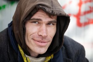 Closeup of man wearing ragged hoody
